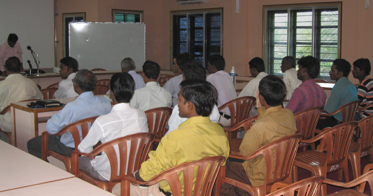 A group of believers listening to a speaker A group of believers listening to a speaker