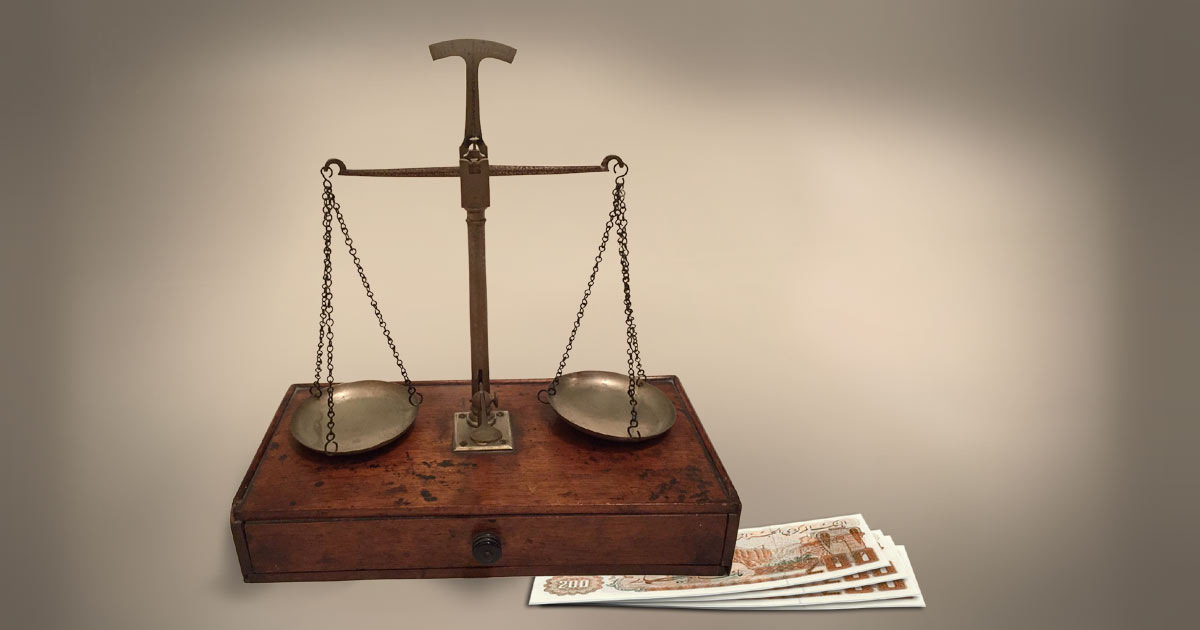 Scales of justice and Algerian dinars Scales of justice and Algerian dinars - Photo: Pixabay (dinars added)