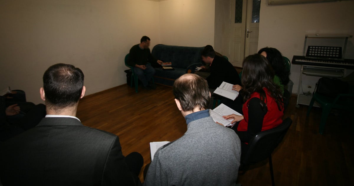 A group of people are studying together.