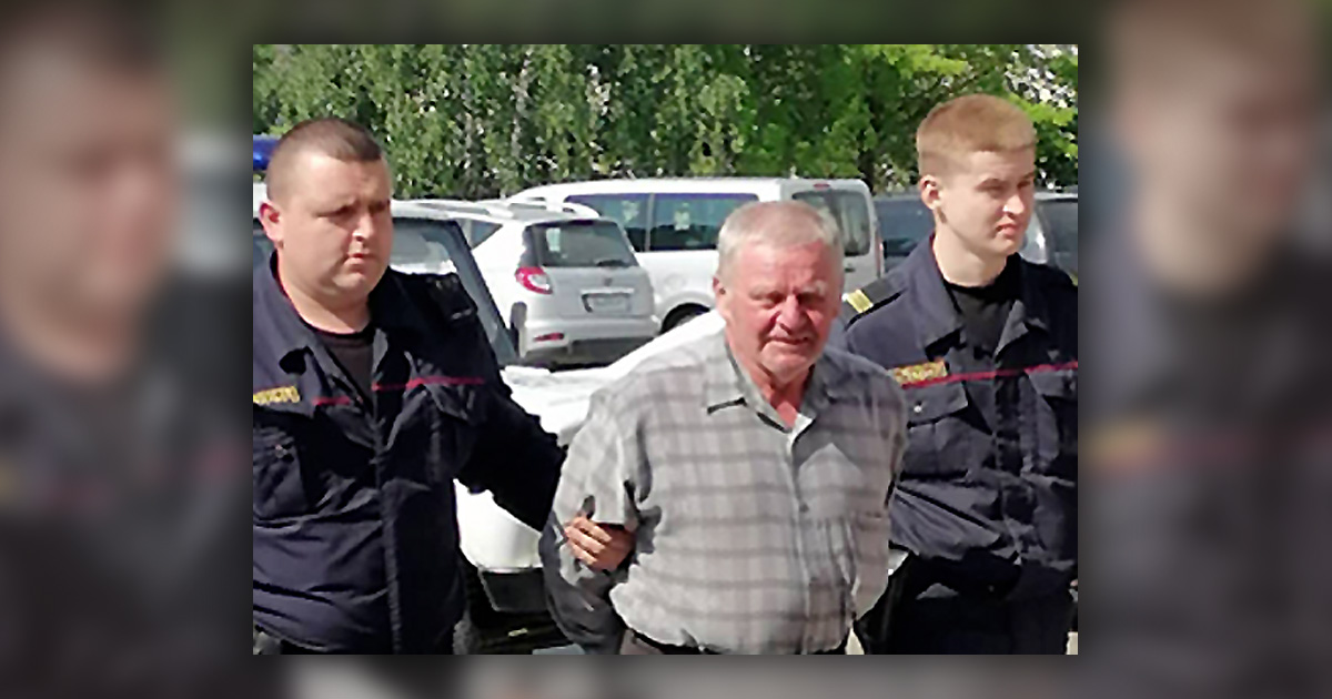 Vladimir Burshtyn being led by officers
