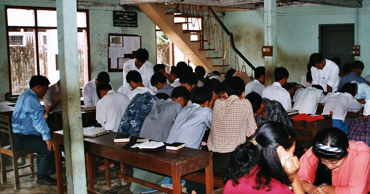 Men and women praying. Men and women praying.