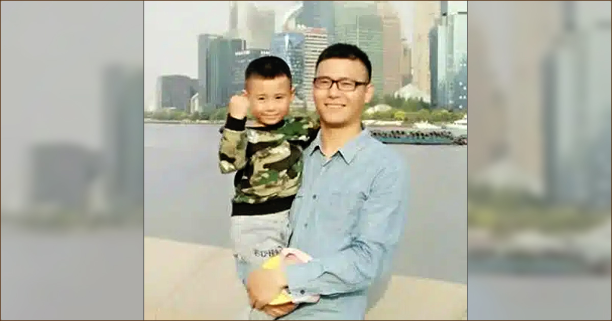 Elder Chang Shun is holding his little boy. Both are smiling. Elder Chang Shun is holding his little boy. Both are smiling.