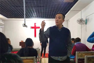 Pastor Geng Zejun in a church Pastor Geng Zejun in a church