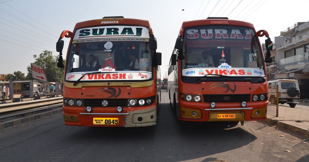The front of two buses in India. The front of two buses in India.
