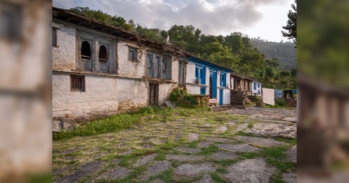 Houses line an old stone street in India.