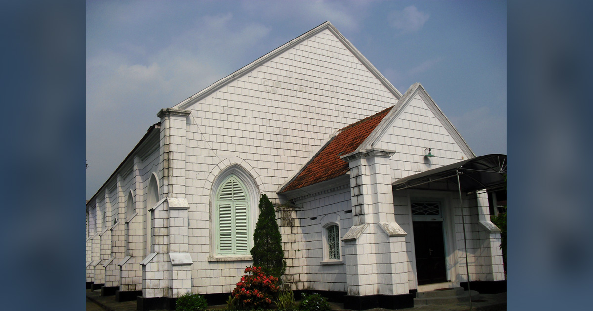 A white church with a red roof.