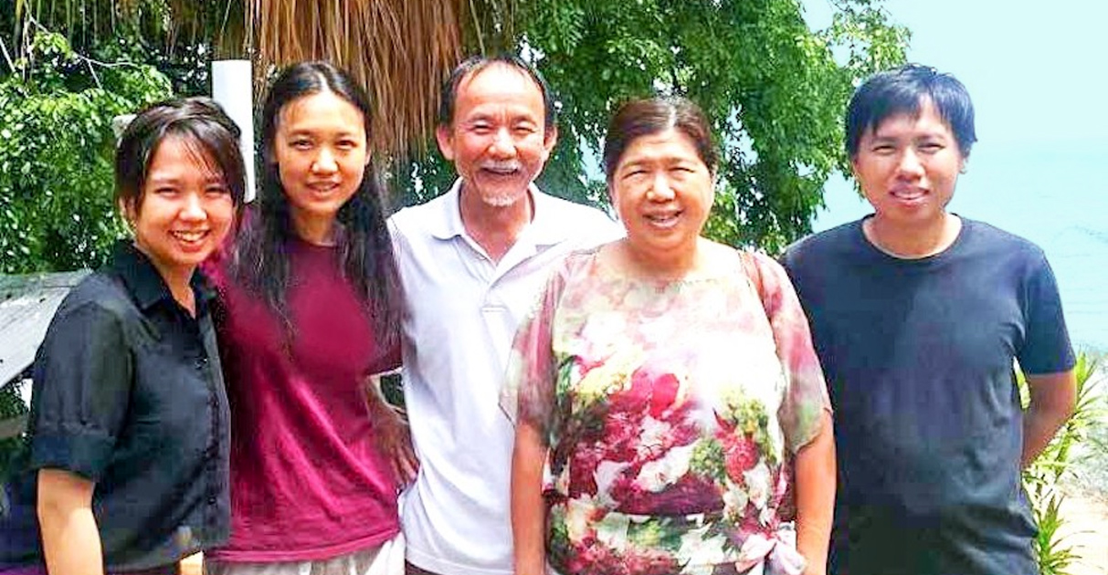 Raymond Koh is with his wife, two daughters, and a son.