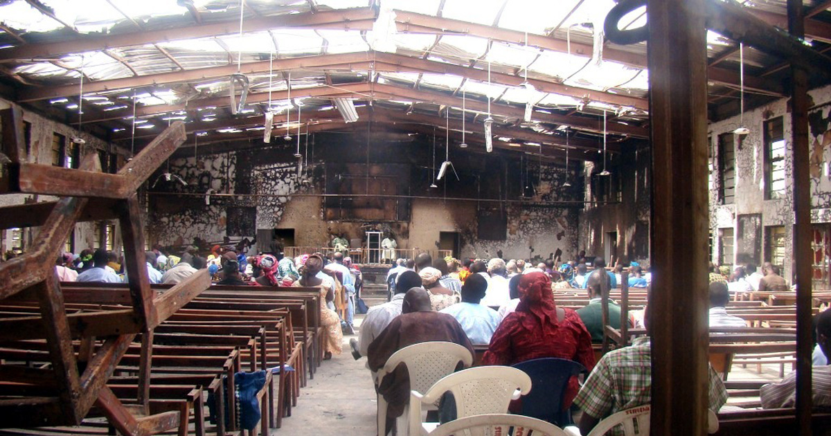 Believers are gathered in the shell of a burned out church. Believers are gathered in the shell of a burned out church.
