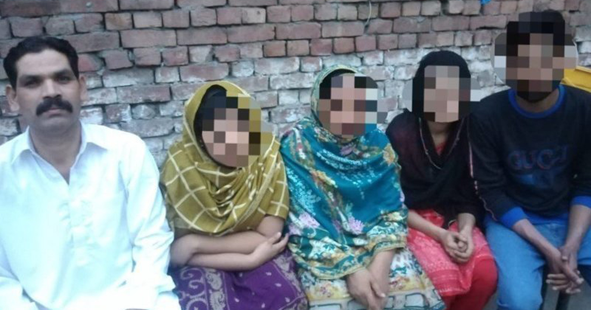 Sawan Masih sitting with his family; all faces pixelated except Sawan's. Sawan Masih sitting with his family; all faces pixelated except Sawan's.