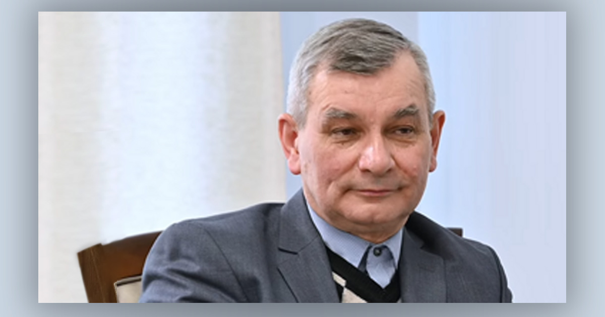 Pastor Vladimir Rytikov sits comfortably in a chair.