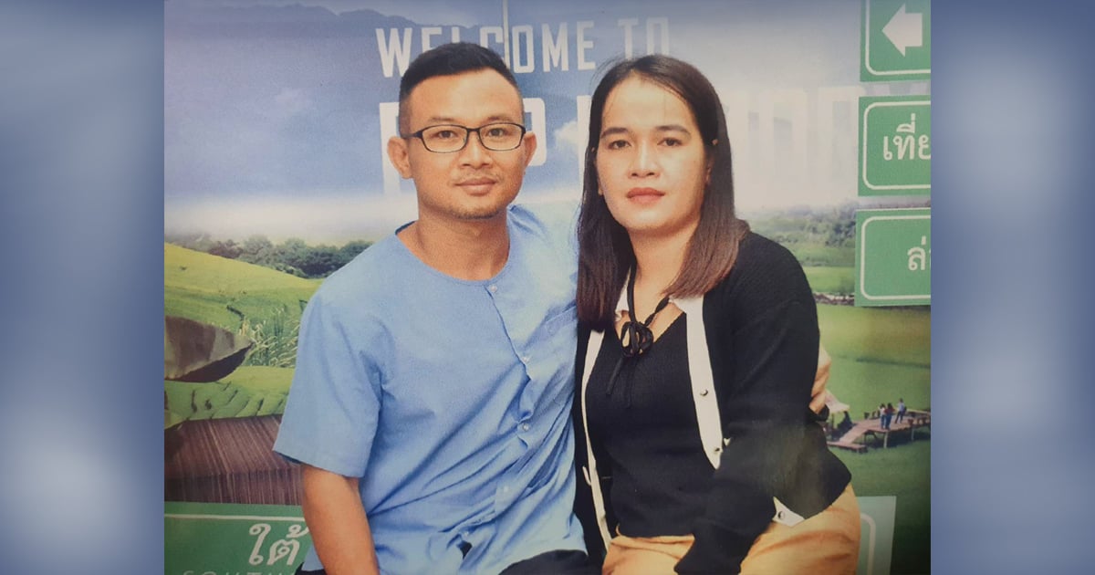 Y Quynh Bdap and his wife are sitting in front of a mural. Y Quynh Bdap and his wife are sitting in front of a mural.