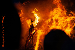 A building is consumed with fire. A building is consumed with fire.