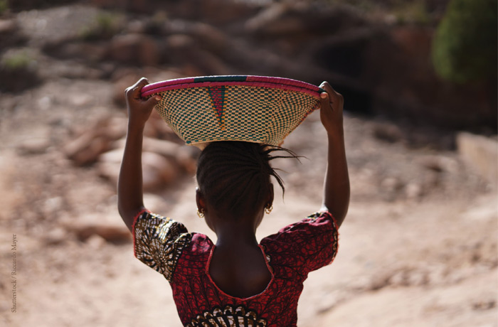 Girl with a basket on her head