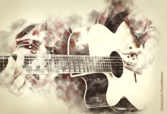 A person playing a guitar A person playing a guitar
