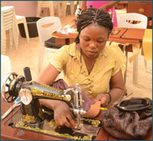 A woman sewing purses