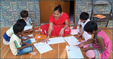 A woman teaching children