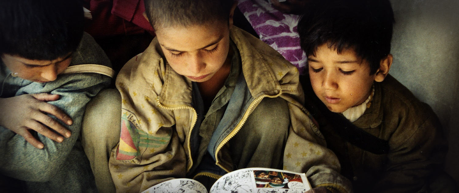 Children reading graphic version of the Bible Children reading graphic version of the Bible - Photo: VOMC